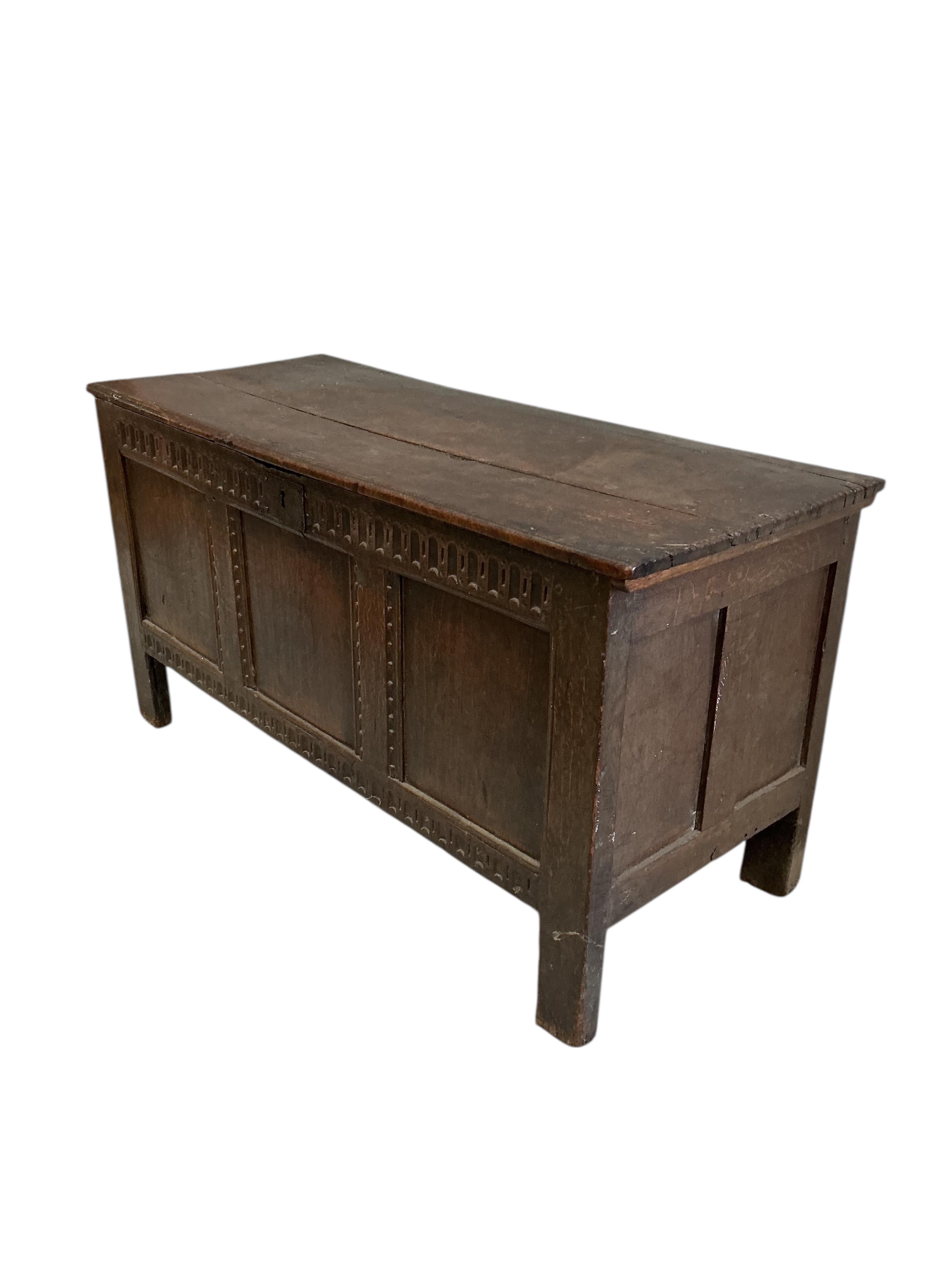 An 18th century oak coffer, width 122cm, depth 49cm, height 63cm